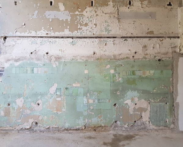The east wall in the 3rd floor of the communal unit: work on defining the time of applying the layers of paint, and their formula. Restoration and adaptaion of the the cultural heritage site “Narkomfin Building” (2017-2020) Copyright: Photograph provided by Ginzburg Architects