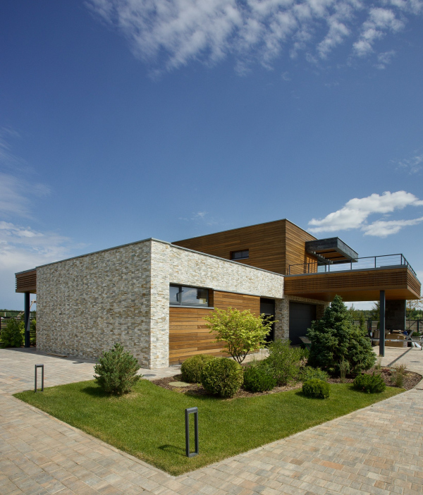 Garage and guest house at the entrance to the plot. Villa Sonata Copyright: Photograph  Roman Leonidov