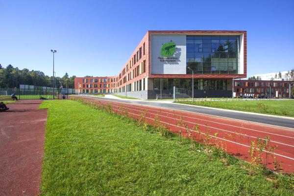 View of the school from the sports fields Copyright: Photograph  Andrey Asadov / provided by ASADOV Architects