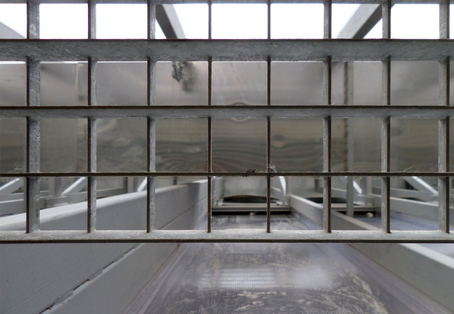 Behind the polycarbonate wall. Photograph � Ilia Mukosey