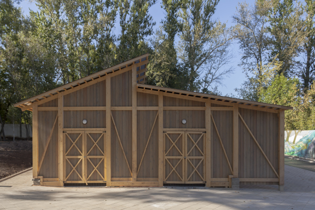 The shed for forage and machinery. Urban farm at VDNKh, 1st phase. WOWhaus Bureau. Photograph  Dmitry Chebanenk