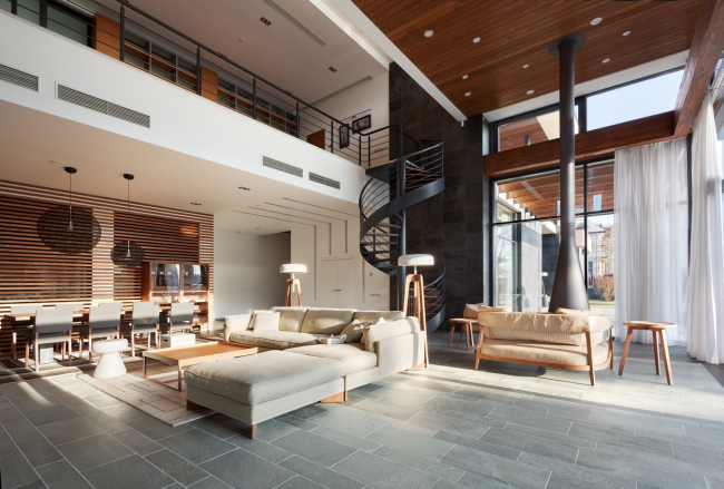 Hampton House. Country residence. Spiral staircase and the fireplace in the living room. Construction, 2016  Roman Leonidov architectural bureau