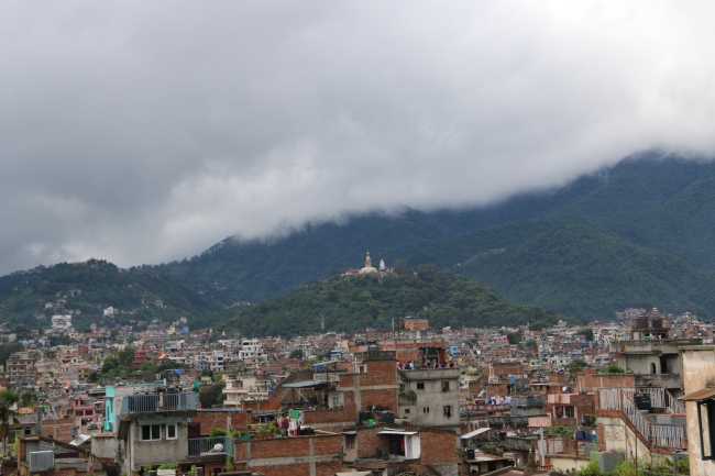 The Swayambhu hillock with the Mahacaitya which used to be an island now overlooks a sea of houses. � Kai Weise