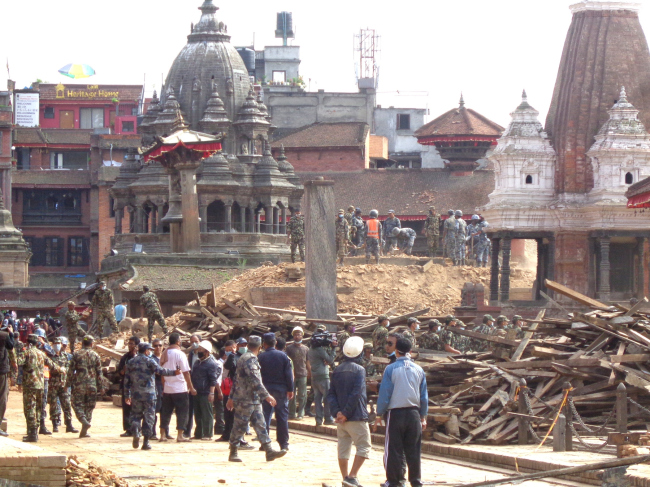 Salvaging work going on after the earthquake with help from army and police, Patan Durbar Square. � Kai Weise