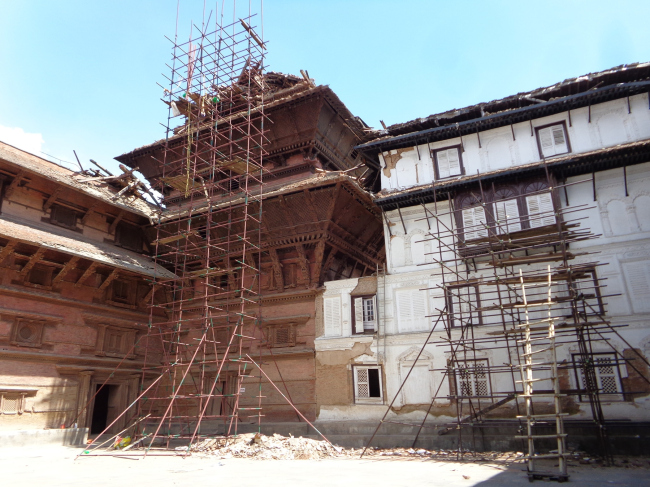 Nasal Chowk of Hanuman Dhoka Palace with pipe scaffoldings set up to remove museum objects and collapsed elements form the nine-storey tower.  Kai Weise