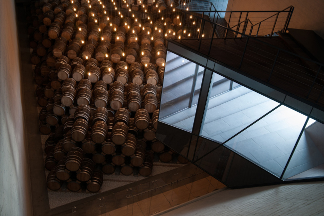 The cantilever that "intrudes" the space of the repository from the outside; Room 3. Repository museum of "Alliance-1892" cognac house. Photograph � Gleb Leonov