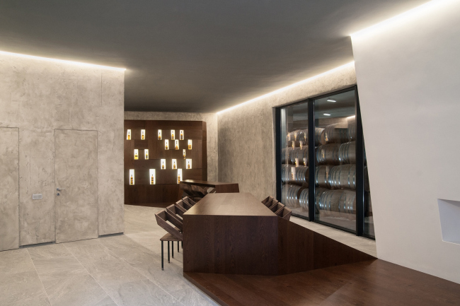 Tasting room; on the right behind the glass one can see casks in Repository 2, situated underneath the inside yard. Repository museum of "Alliance-1892" cognac house � TOTEMENT / PAPER