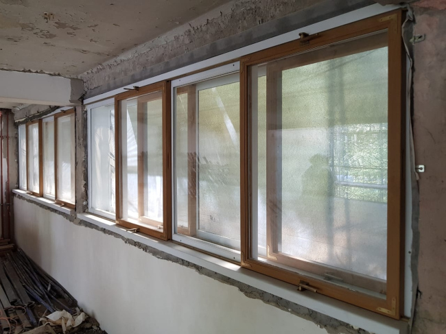 The Narkomfin Building. The renovated windows. Photo courtesy by Ginsburg Architects