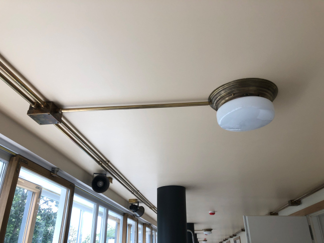 The recreated system of exposed wiring. Restoration and adaptaion of the the cultural heritage site Narkomfin Building (2017-2020)