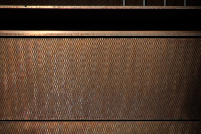 Fragment of the texture of the copper panels with a pattern. The housing complex "Medny 3.14"