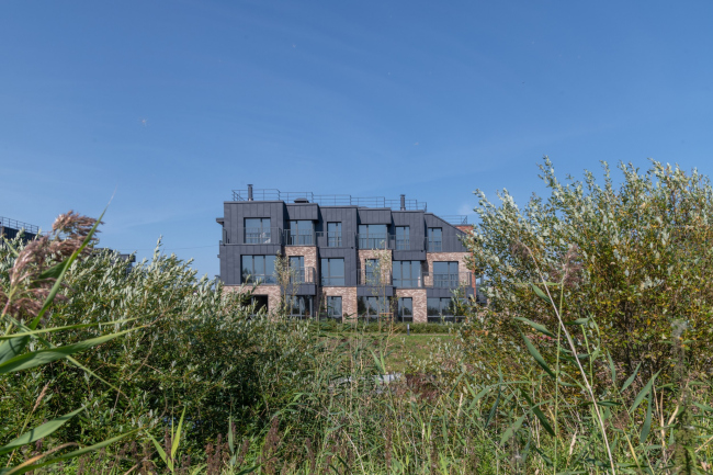 View of the opposite bank of the creek. Veren Village housing complex