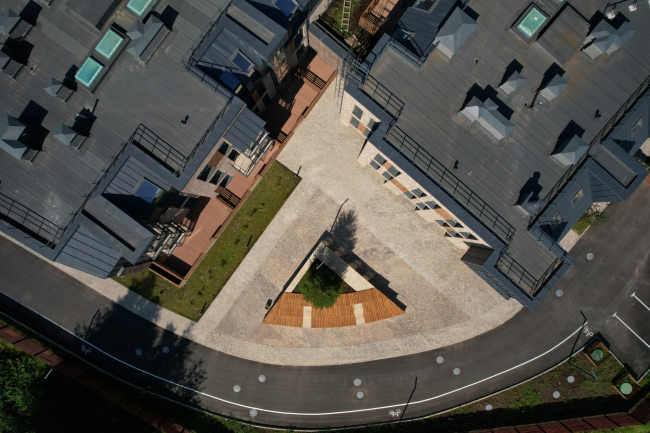 The entrance plaza with an amphitheater, top view. Veren Village housing complex